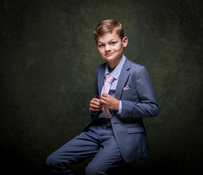 A handsome Communion boy during his first Holy Communion Portrait session at Cormac Byrne Photograph, Limerick, Ireland.  