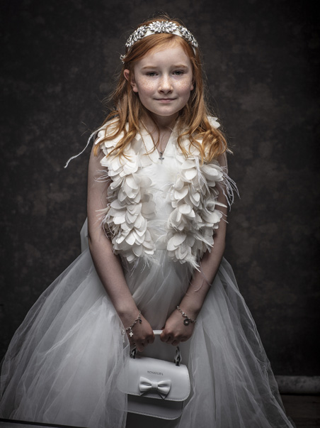 A casual First Holy Communion Portrait girl ready for her portrait at Cormac Byrne Photography, Limerick, Ireland.  