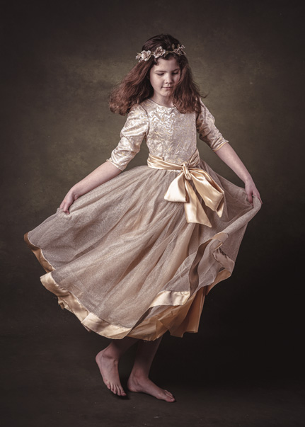 Portrait of a young girl dancing as a fine art image by Cormac Byrne.  